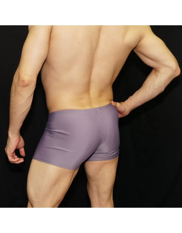 Men's lavender squarecut swimwear by Arroyman featuring a snug fit and smooth fabric shown from the back.