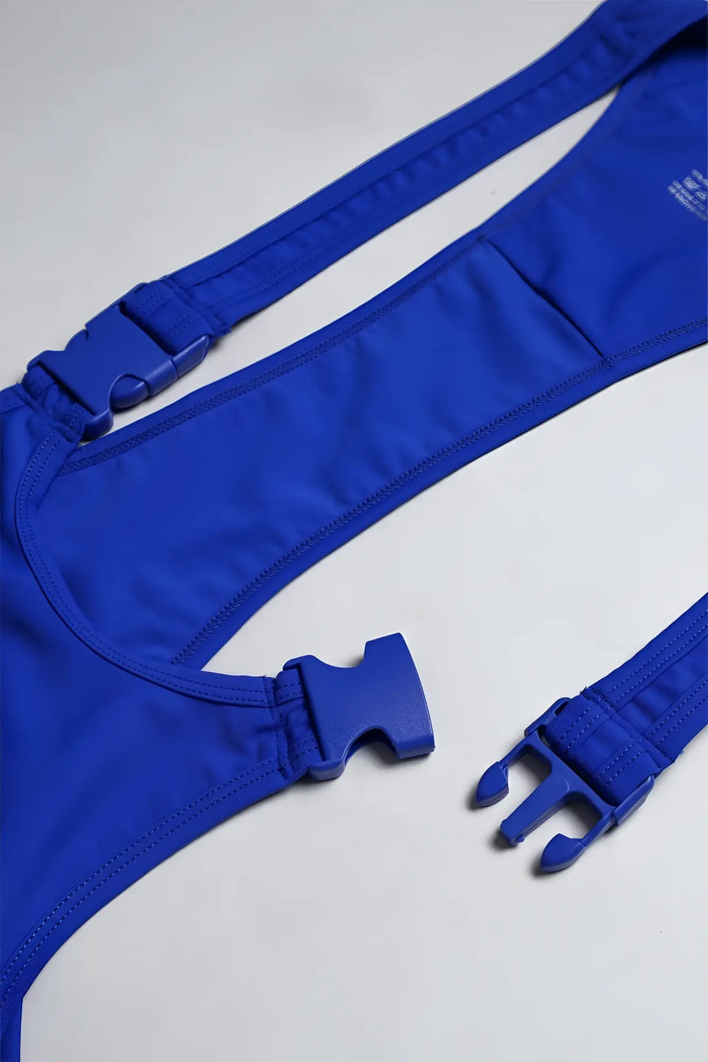 Royal blue men’s athletic wrestling singlet bodysuit with stretchy bikini top and adjustable plastic buckle straps