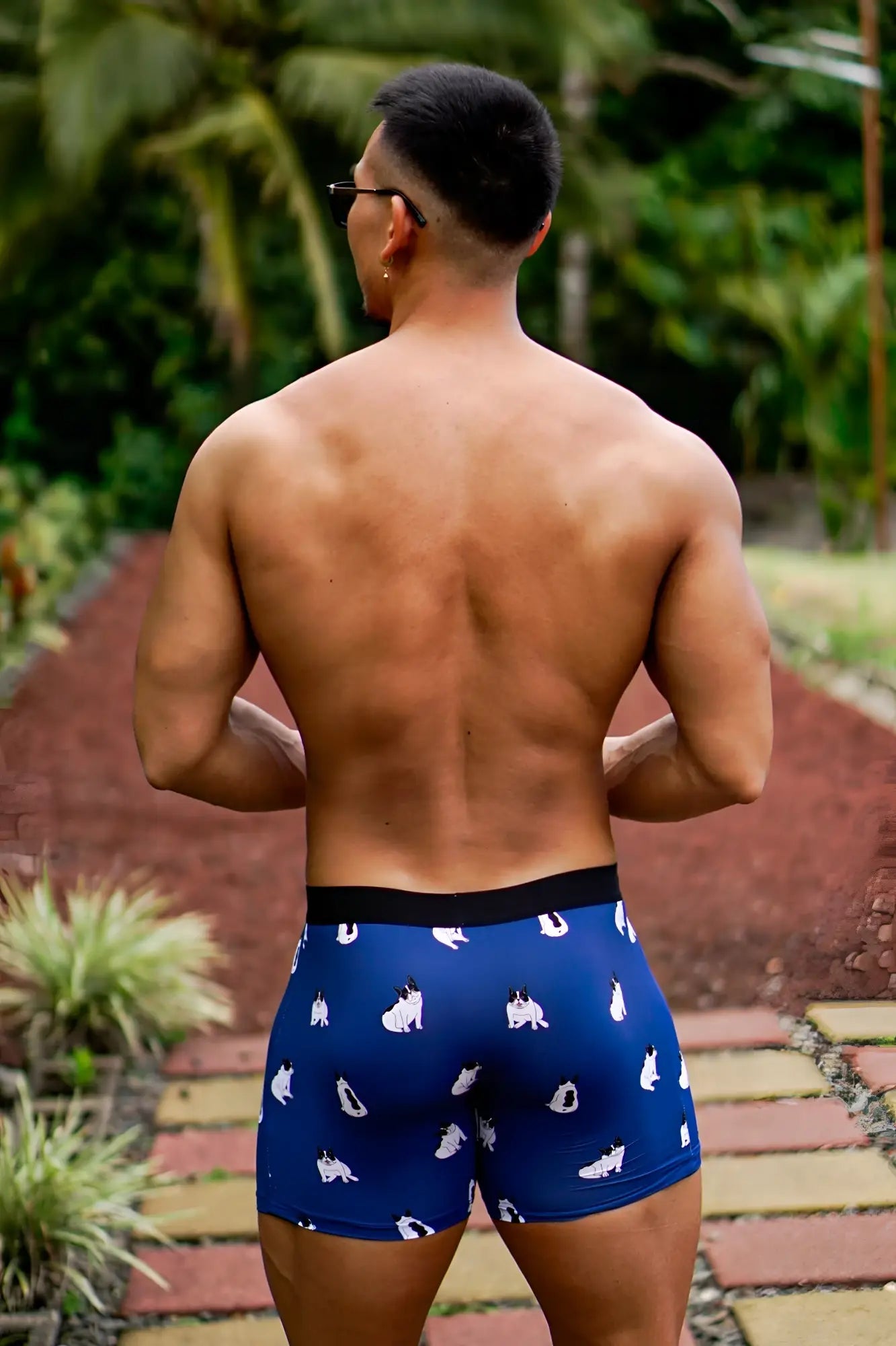 Men’s blue boxer briefs with black waistband featuring white pug dogs pattern for comfortable daily wear