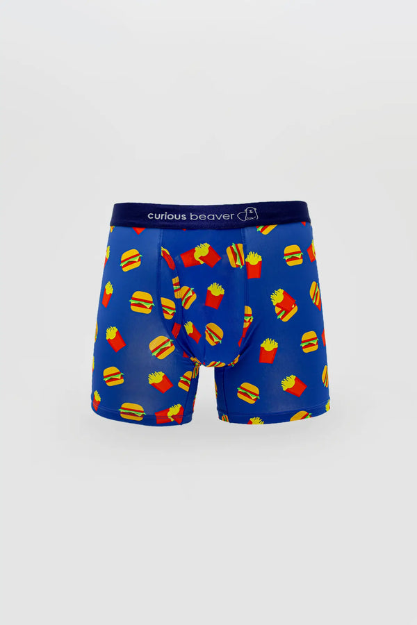Mens blue boxer briefs with yellow burger and red fries pattern on vibrant fabric featuring curious beaver logo waistband