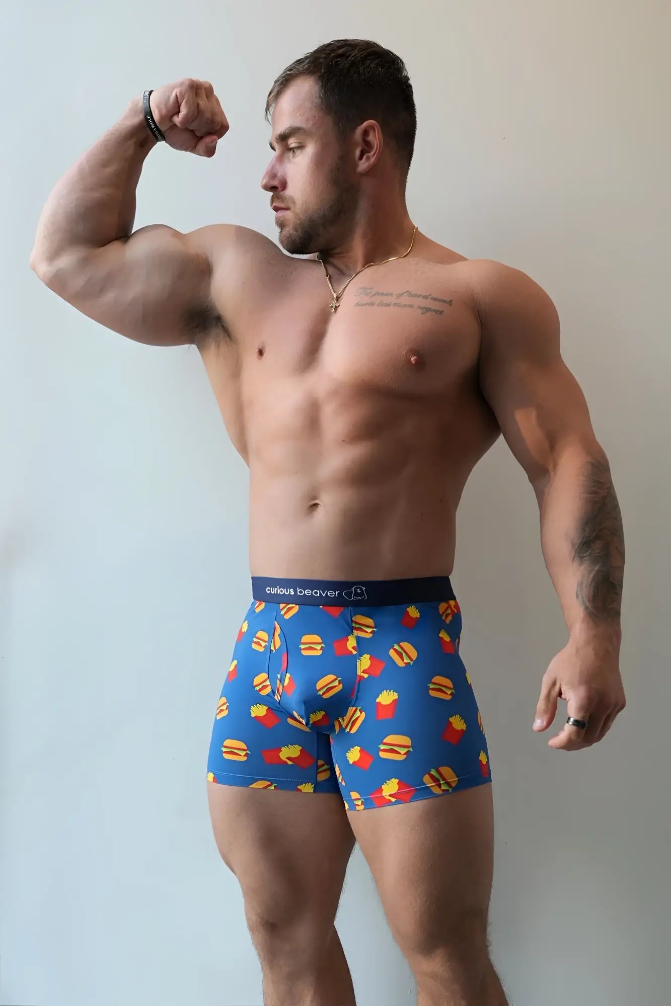 Men’s blue boxer briefs with playful yellow and red burger and fries pattern and cute beaver logo waistband