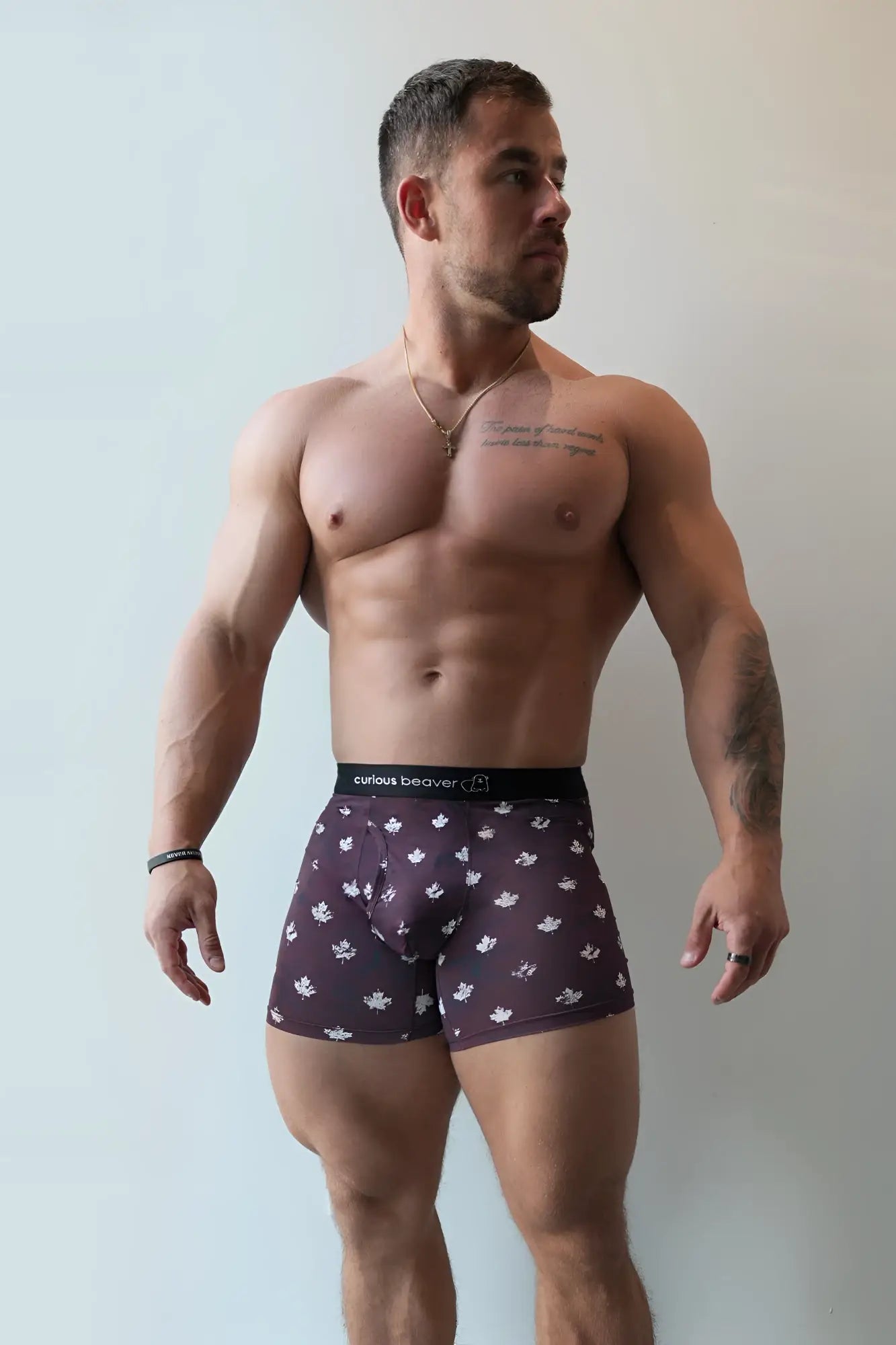 Dark purple men’s boxer briefs with white maple leaf pattern and black waistband featuring civitas beaver brand name