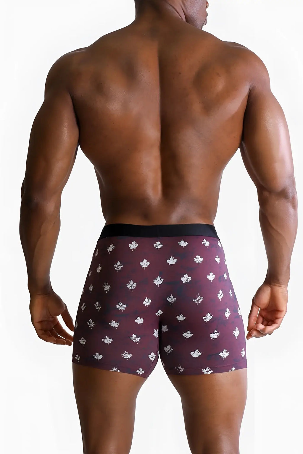 Men’s maroon boxer briefs with white maple leaf pattern and black waistband featuring canada flag design
