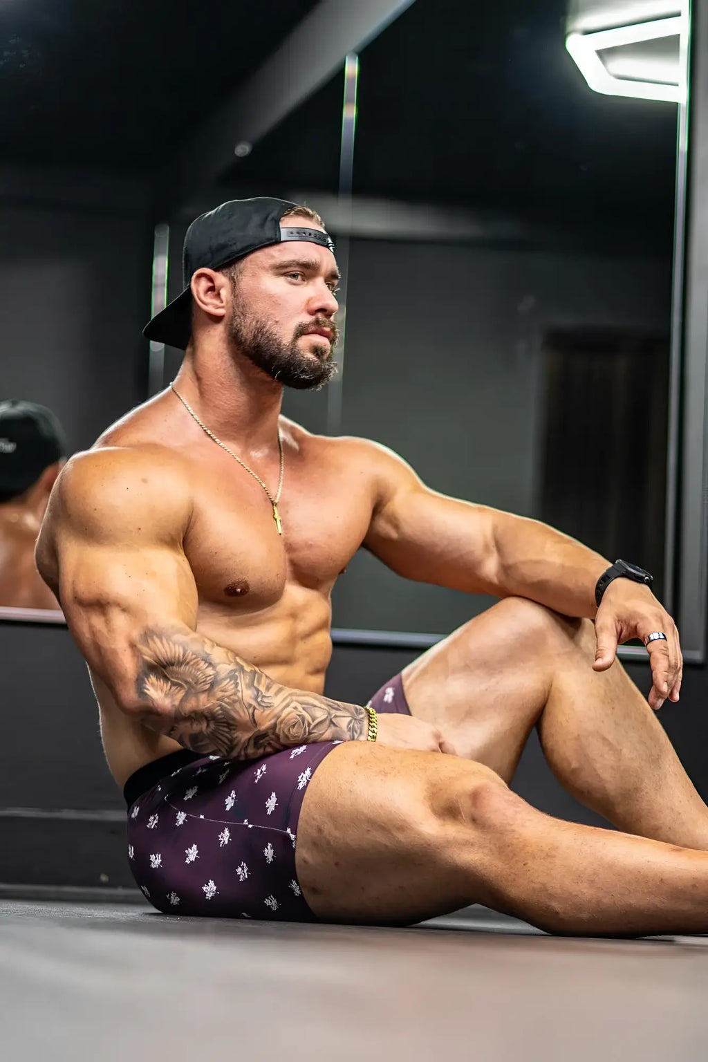 Men’s boxer briefs with purple patterned athletic fabric and white floral designs featuring canada flag details