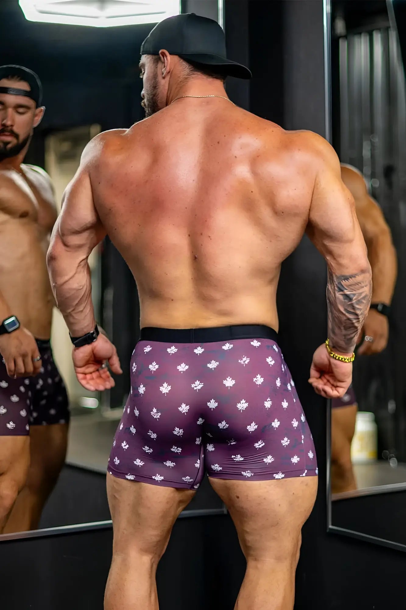 Men’s purple boxer briefs with white maple leaf pattern and black elastic waistband canada flag design