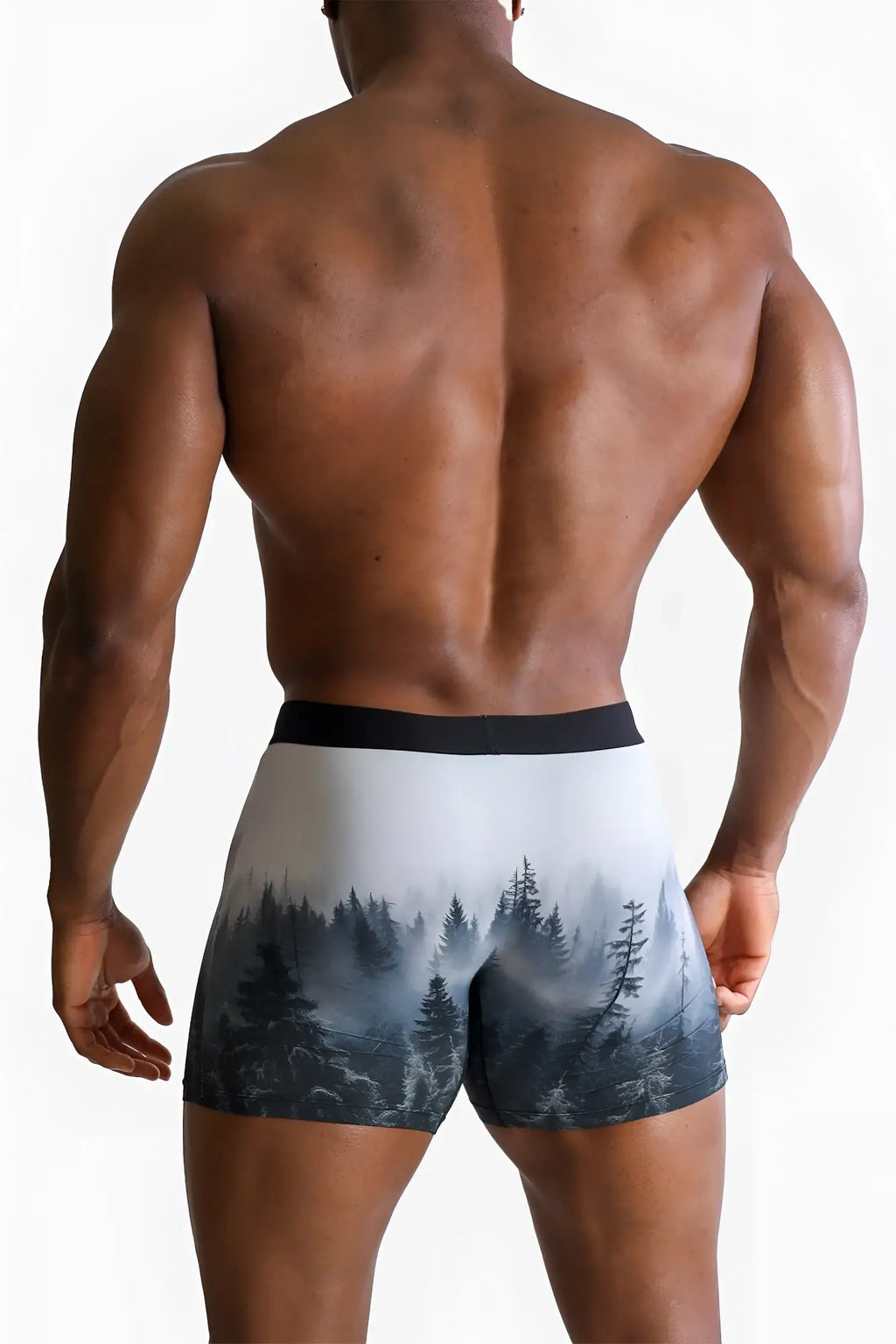 Men’s black and white forest-themed boxer briefs with misty pine tree design and comfortable fabric