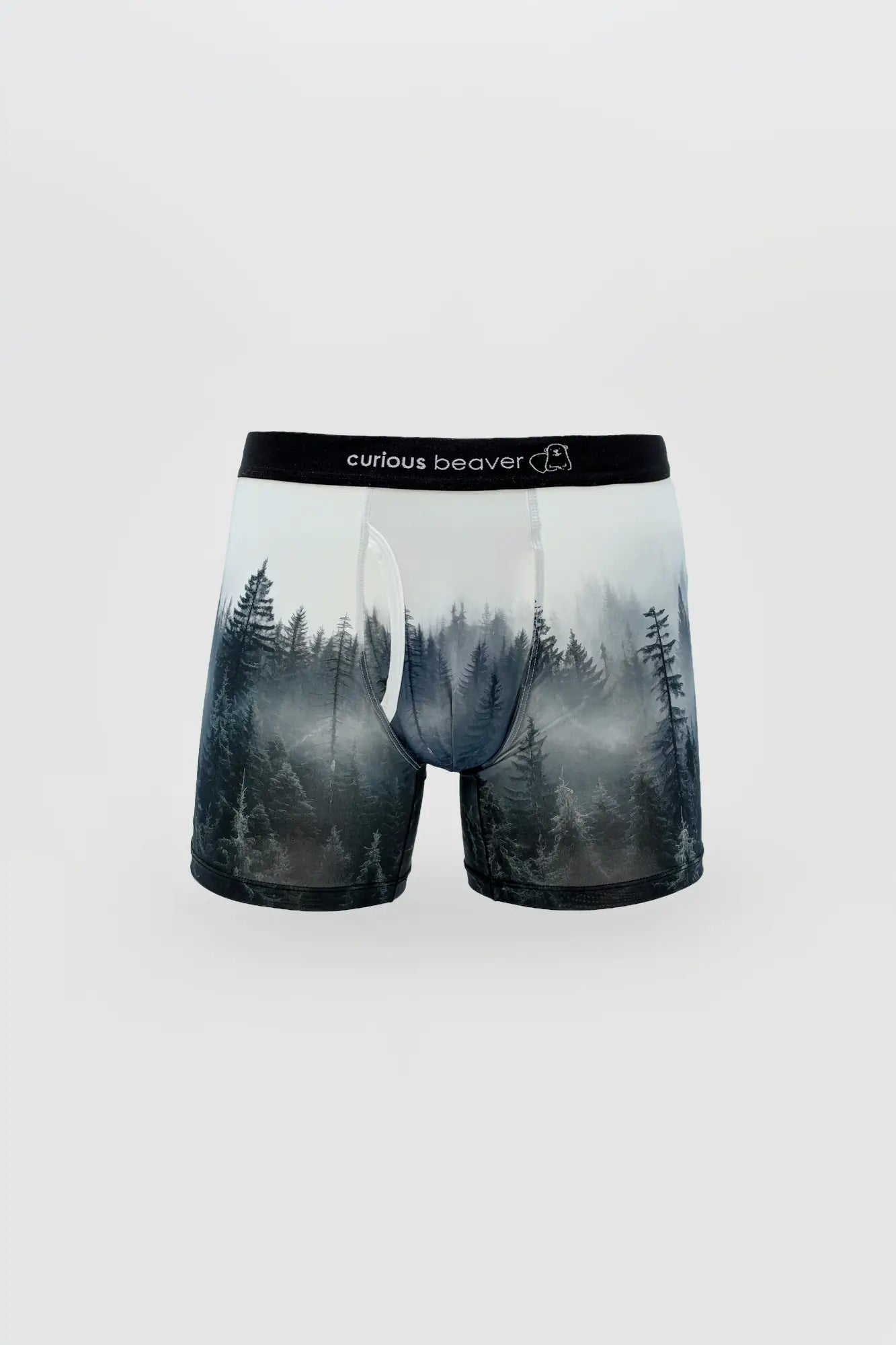 Misty forest-themed men’s boxer briefs in soft translucent fabric with black elastic waistband featuring curious beaver logo
