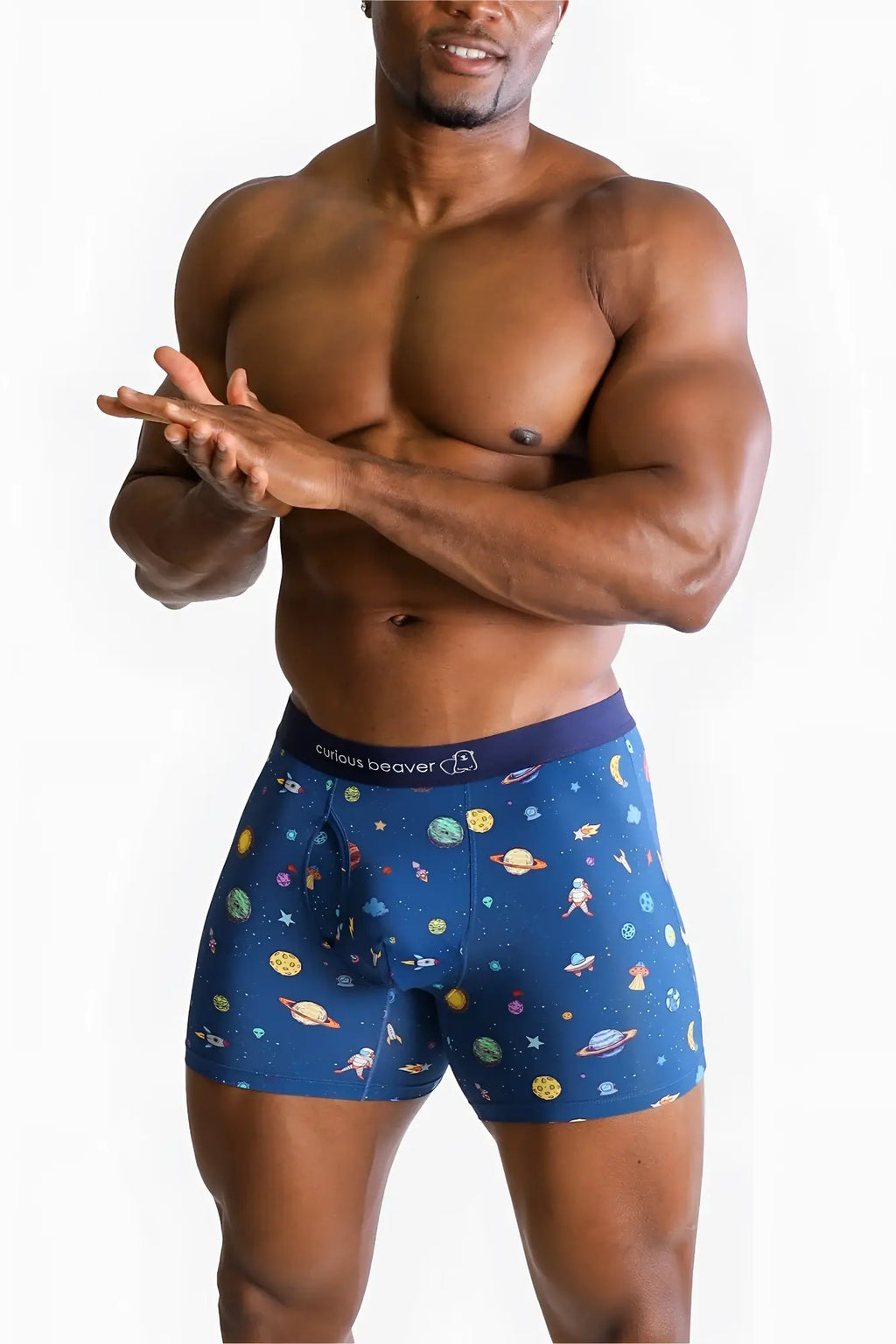 Men’s boxer briefs galaxy with blue space-themed pattern featuring planets stars and astronauts on dark blue fabric