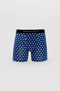 Men’s navy blue boxer briefs with white polka dots and a black waistband featuring the Curious Beaver logo