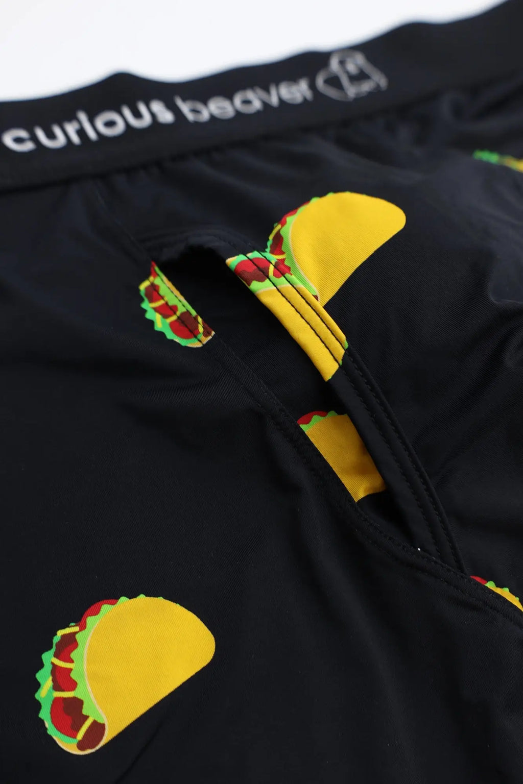 Men’s black boxer briefs with a playful taco print featuring yellow shells green lettuce and red meat fillings