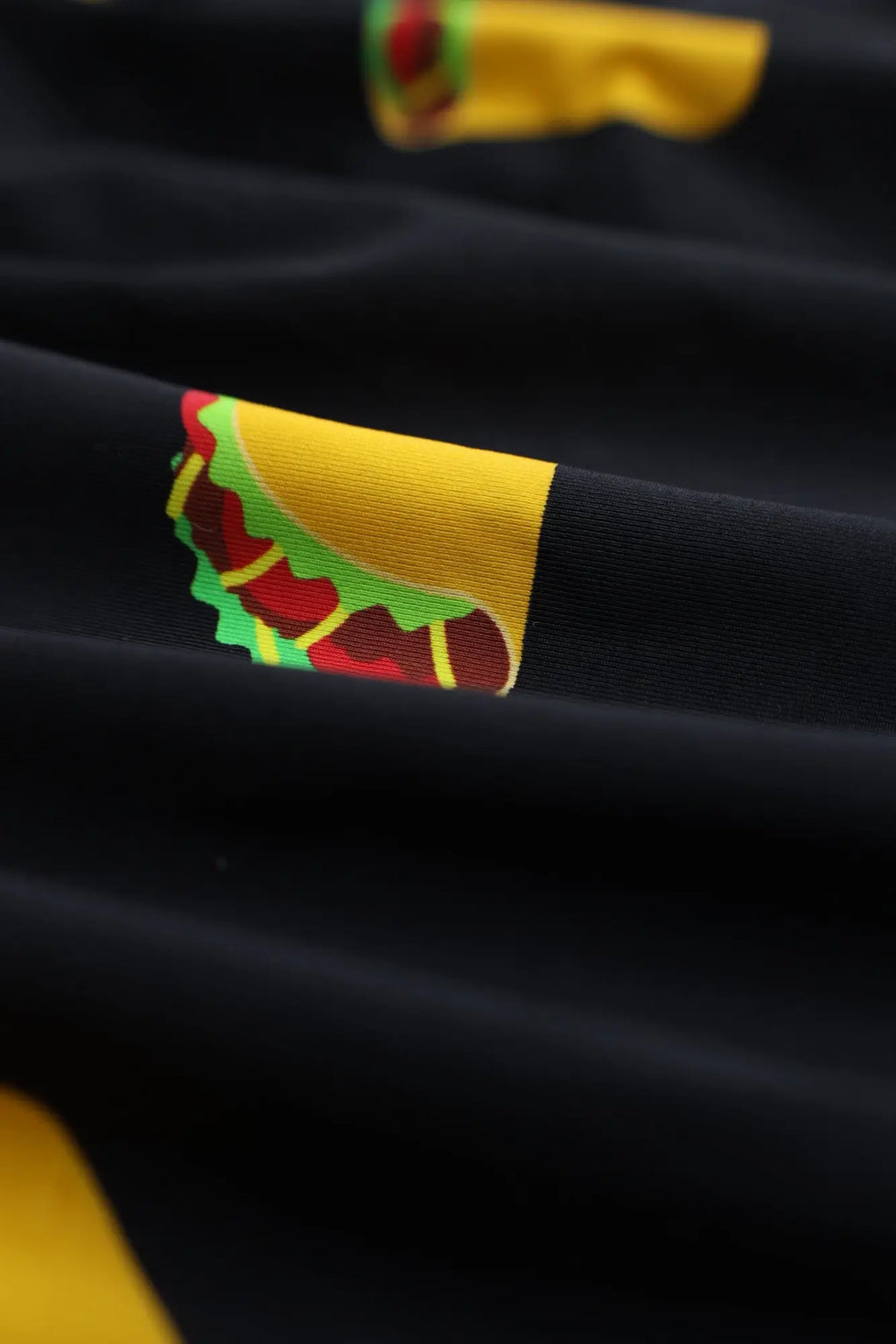 Men’s black cotton boxer briefs featuring a vibrant colorful taco graphic printed on the fabric
