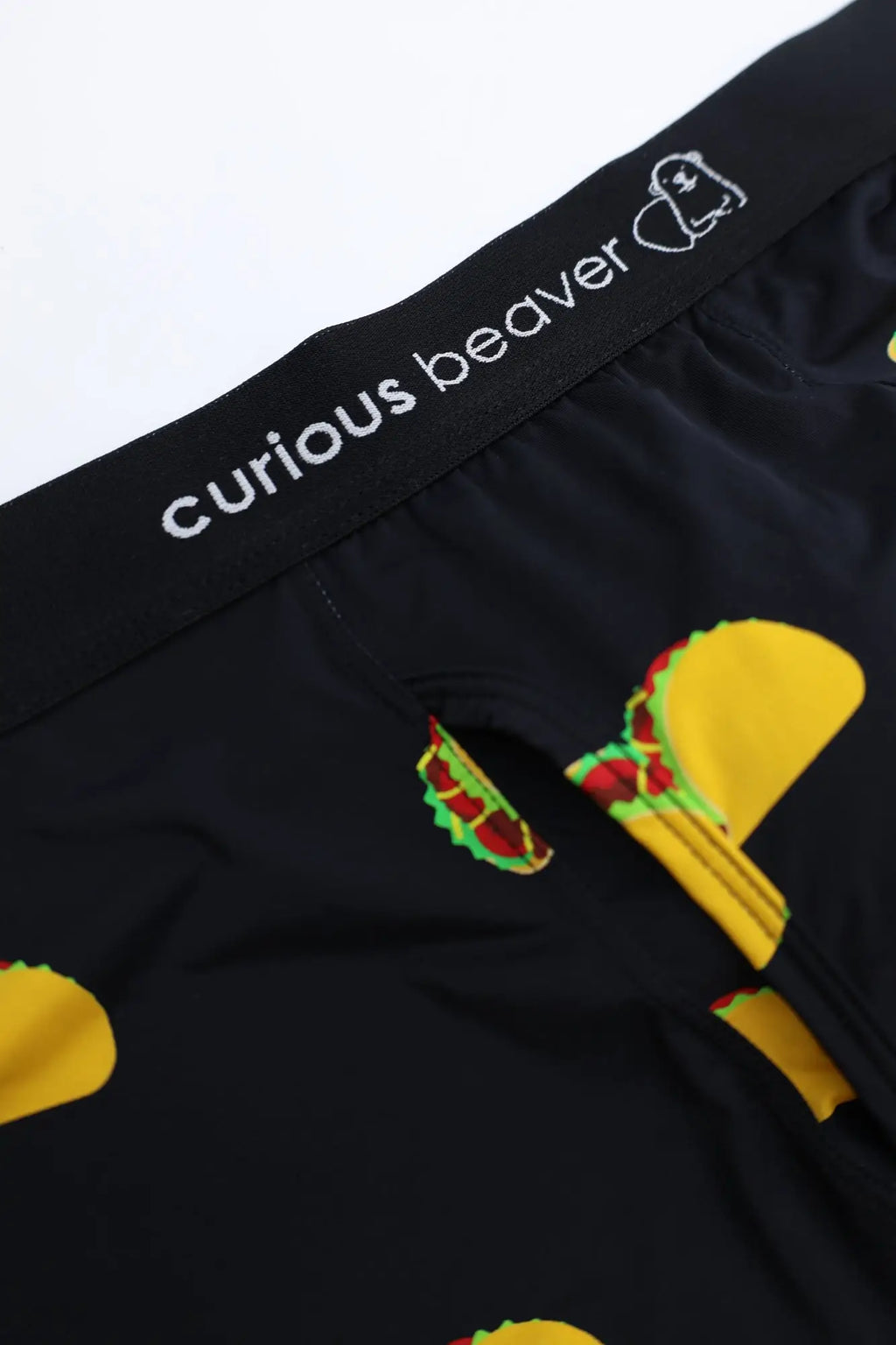 Men’s boxer briefs with a playful taco print featuring yellow shells green lettuce and red meat fillings