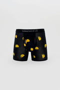 Black men’s boxer briefs with yellow taco pattern and green red accents branded curious beaver on waistband