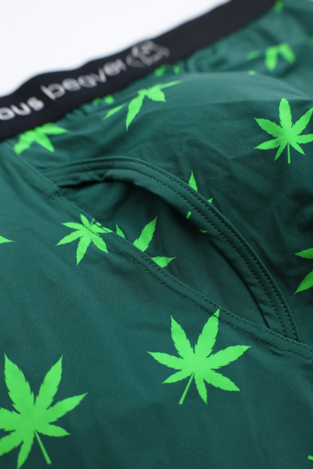 Men’s dark green boxer briefs with neon green cannabis leaf pattern and black cousin beaver branded waistband