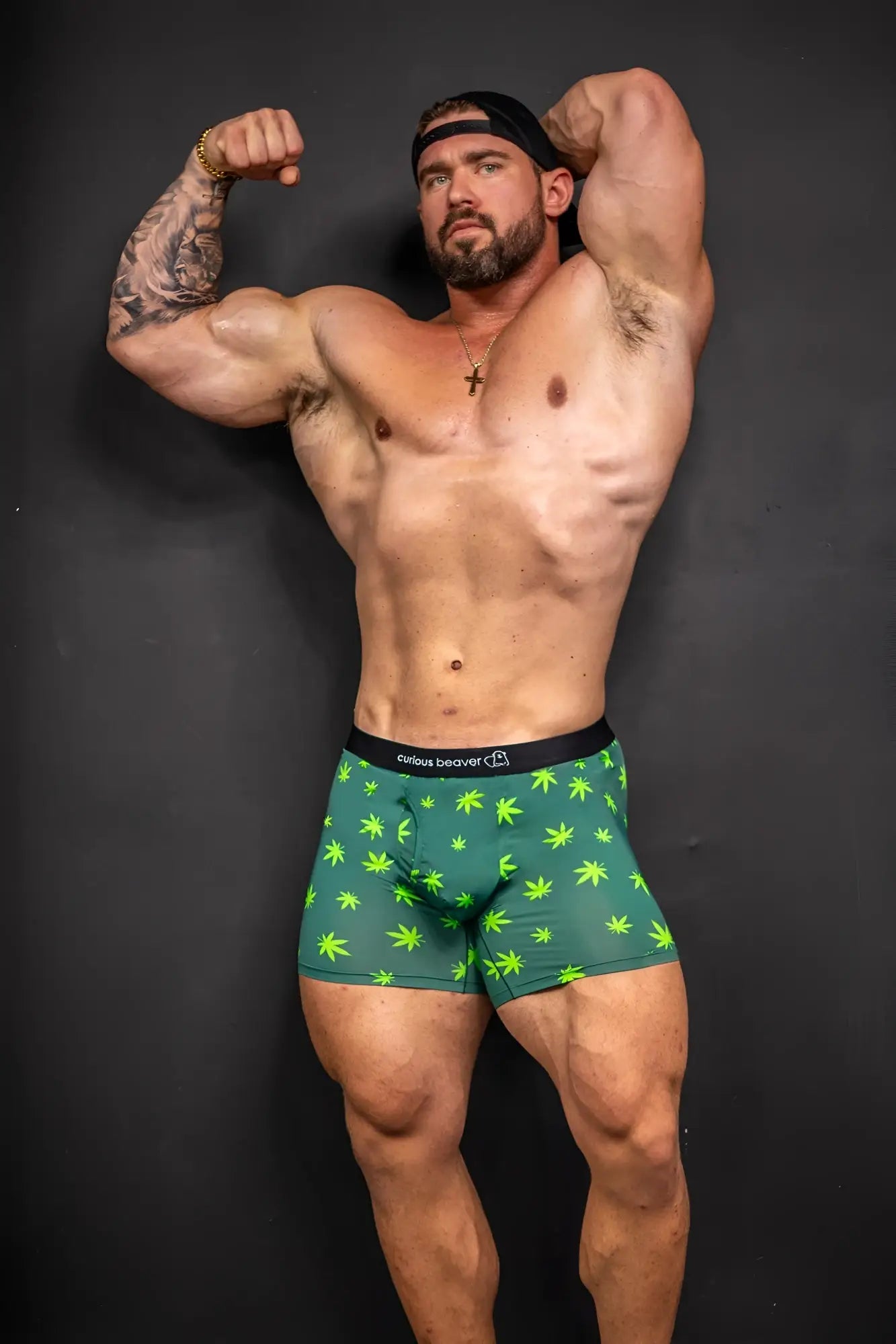 Men’s green boxer briefs with neon green cannabis leaf patterns and black waistband featuring jules beaver brand name