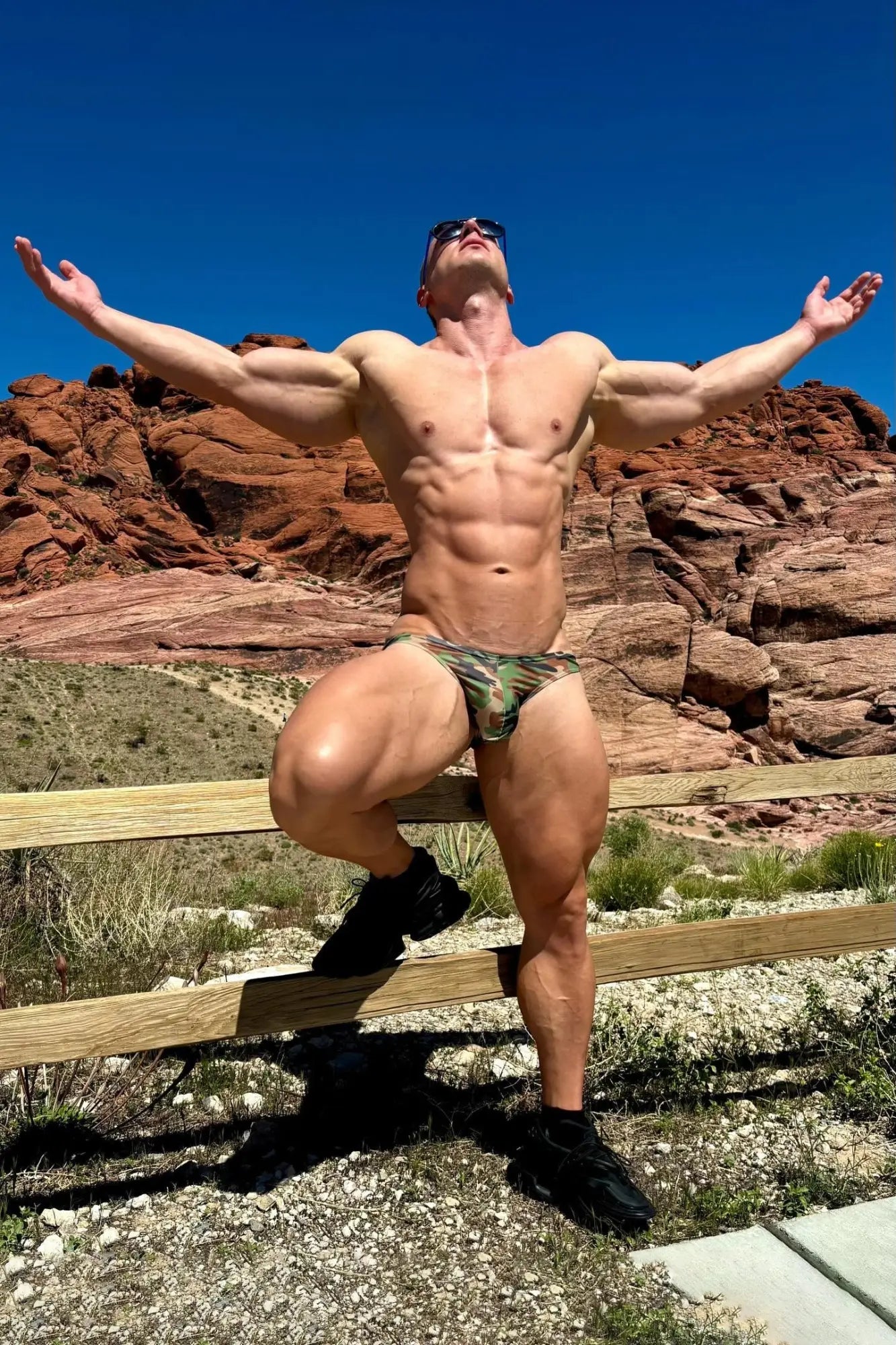 Men’s slimmer bulge briefs in camouflage print worn by a muscular man outdoors showing fit and design