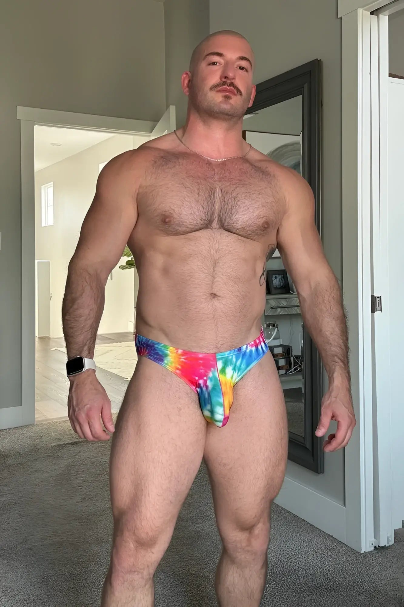 Men’s slimmer bulge briefs in vibrant rainbow tie dye featuring slim fit design and comfortable stretch fabric