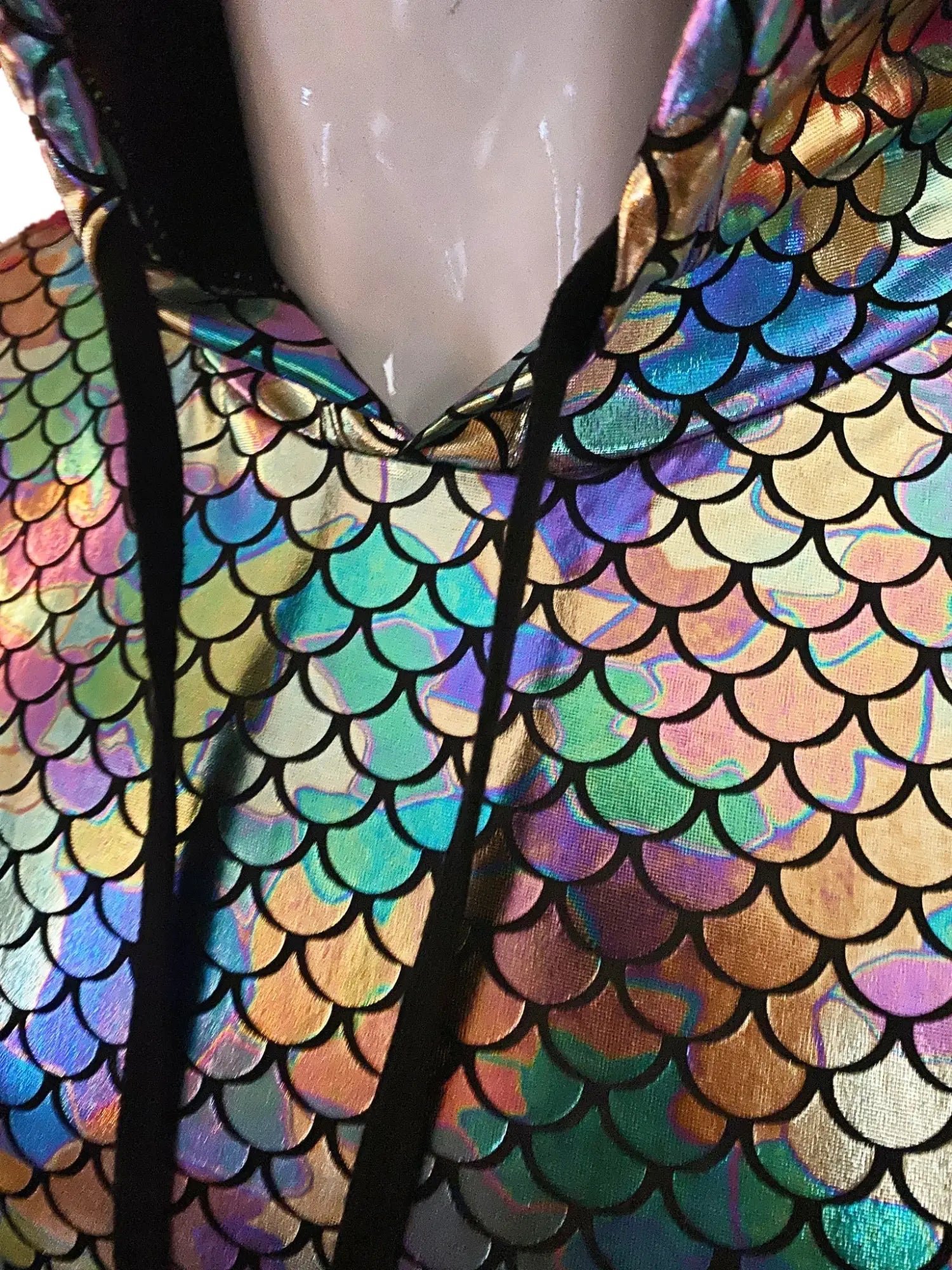 Merman hooded crop tank with a shimmering iridescent scale pattern shifting between rainbow hues and black outlines