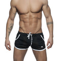 Black mesh athletic shorts with white trim and drawstring designed for comfort and breathability in active use