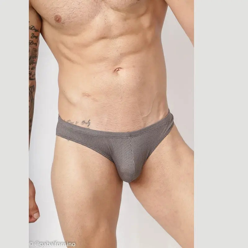 Grey mesh bikini underwear by Arroyman featuring a snug fit and breathable fabric shown on a model.