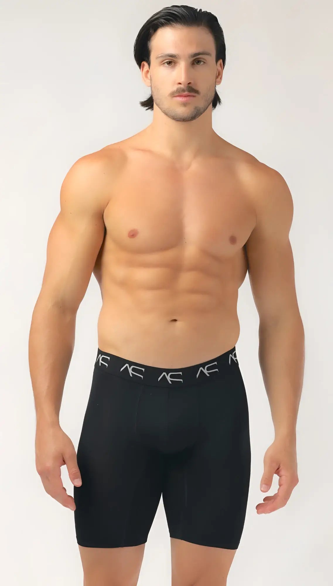 Black ac brand men’s mesh long trunks compression shorts with snug fit and white logo trim on waistband