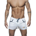 White mesh athletic shorts with navy blue drawstring and trim featuring a colorful rainbow logo on the lower right leg