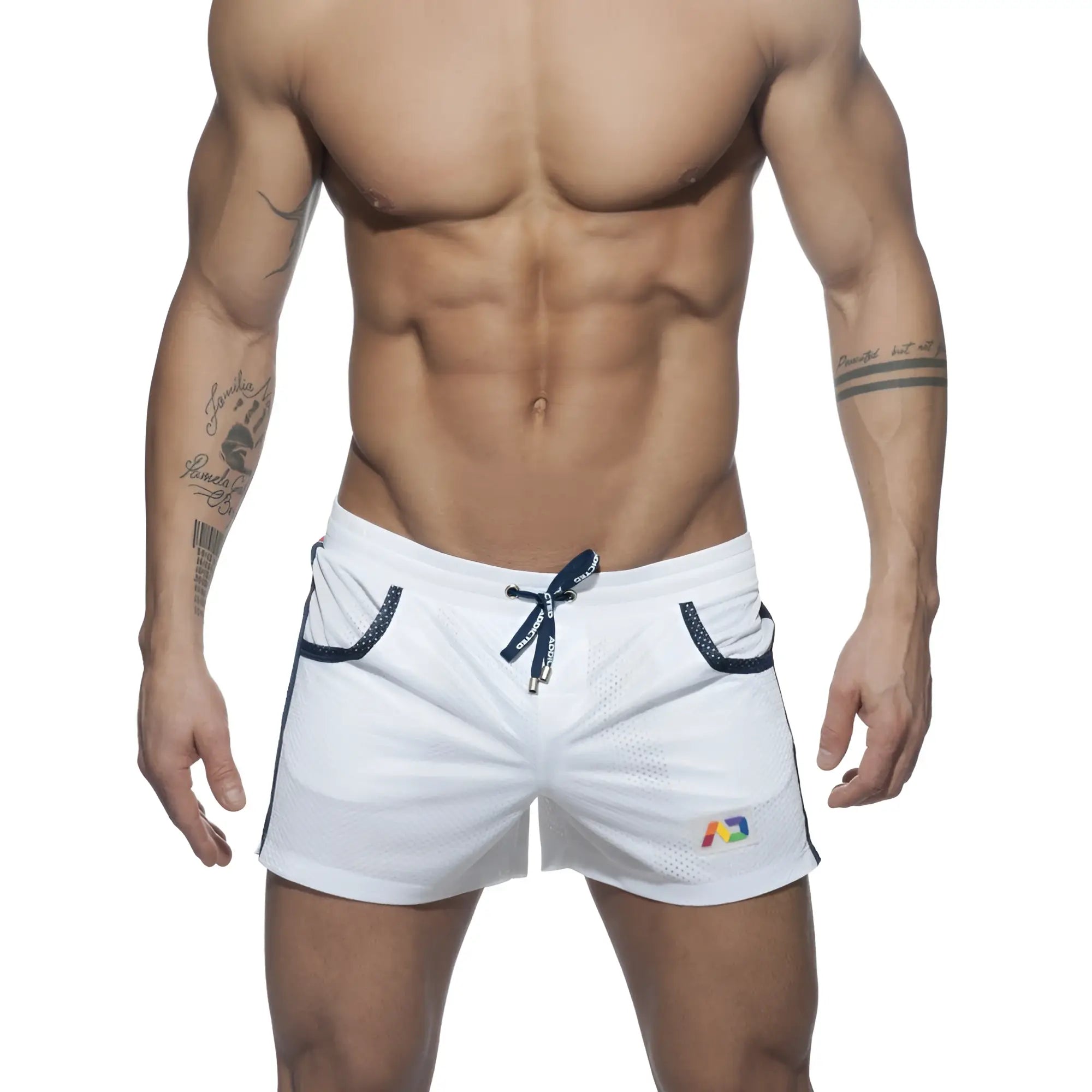 White mesh athletic shorts with navy blue drawstring and trim featuring a colorful rainbow logo on the lower right leg