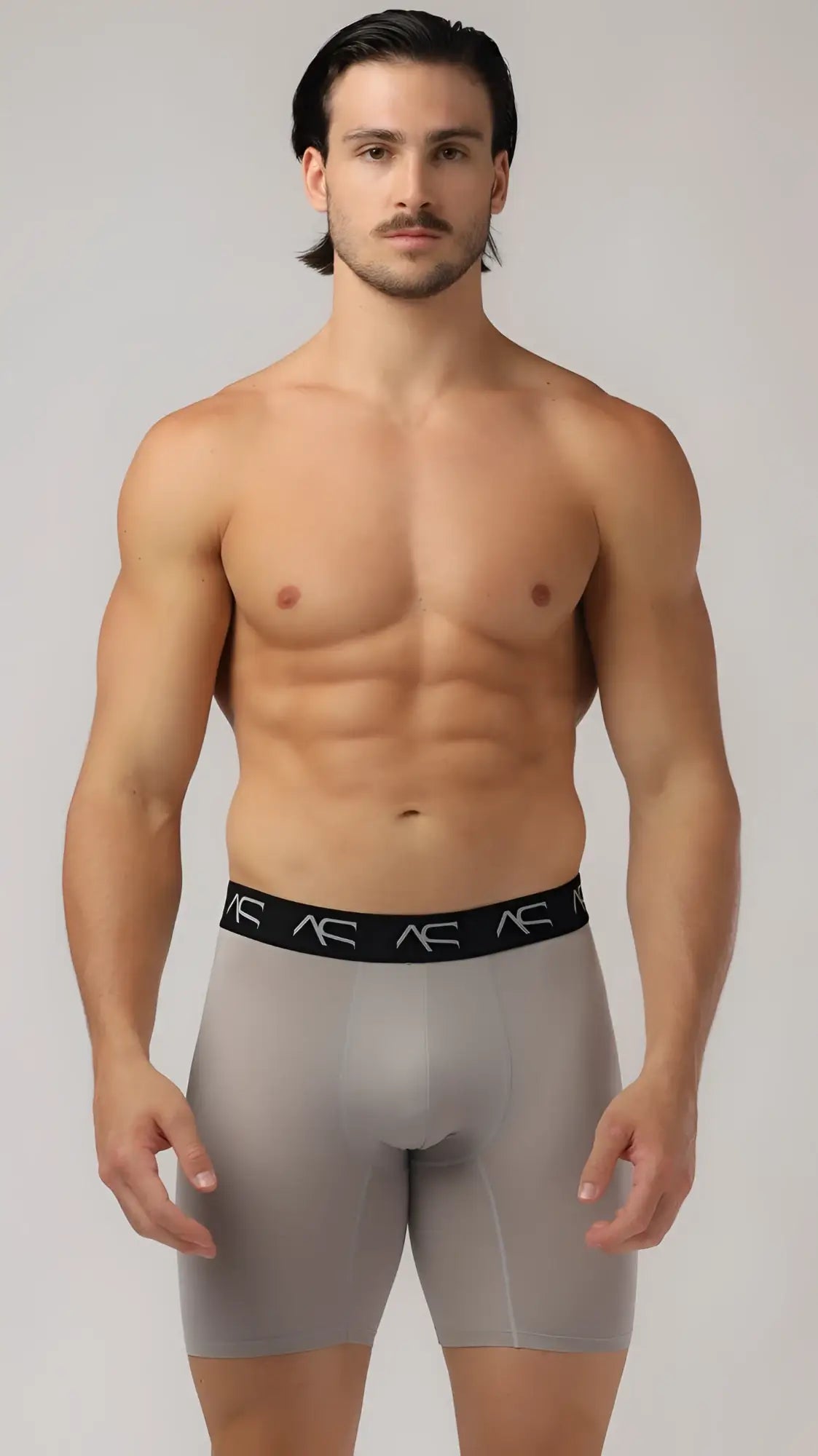 Gray mesh short trunks athletic briefs with black waistband featuring ac logo for activewear use