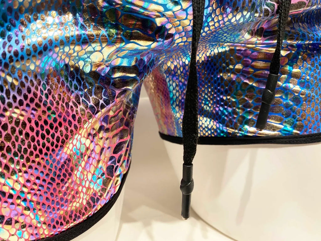 Metallic snake pocket shorts featuring iridescent snake-scale pattern with black drawstrings for casual wear