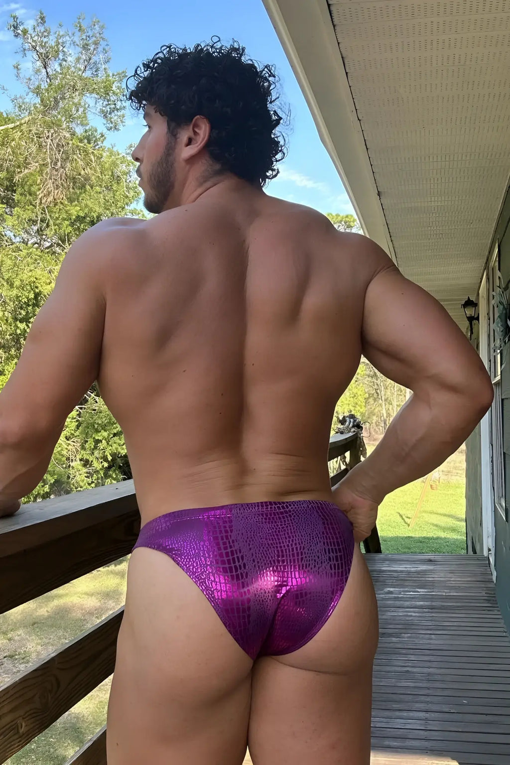 Shiny purple metallic briefs with a textured scale-like pattern in metallica brief with bulge pouch hot pink croc design