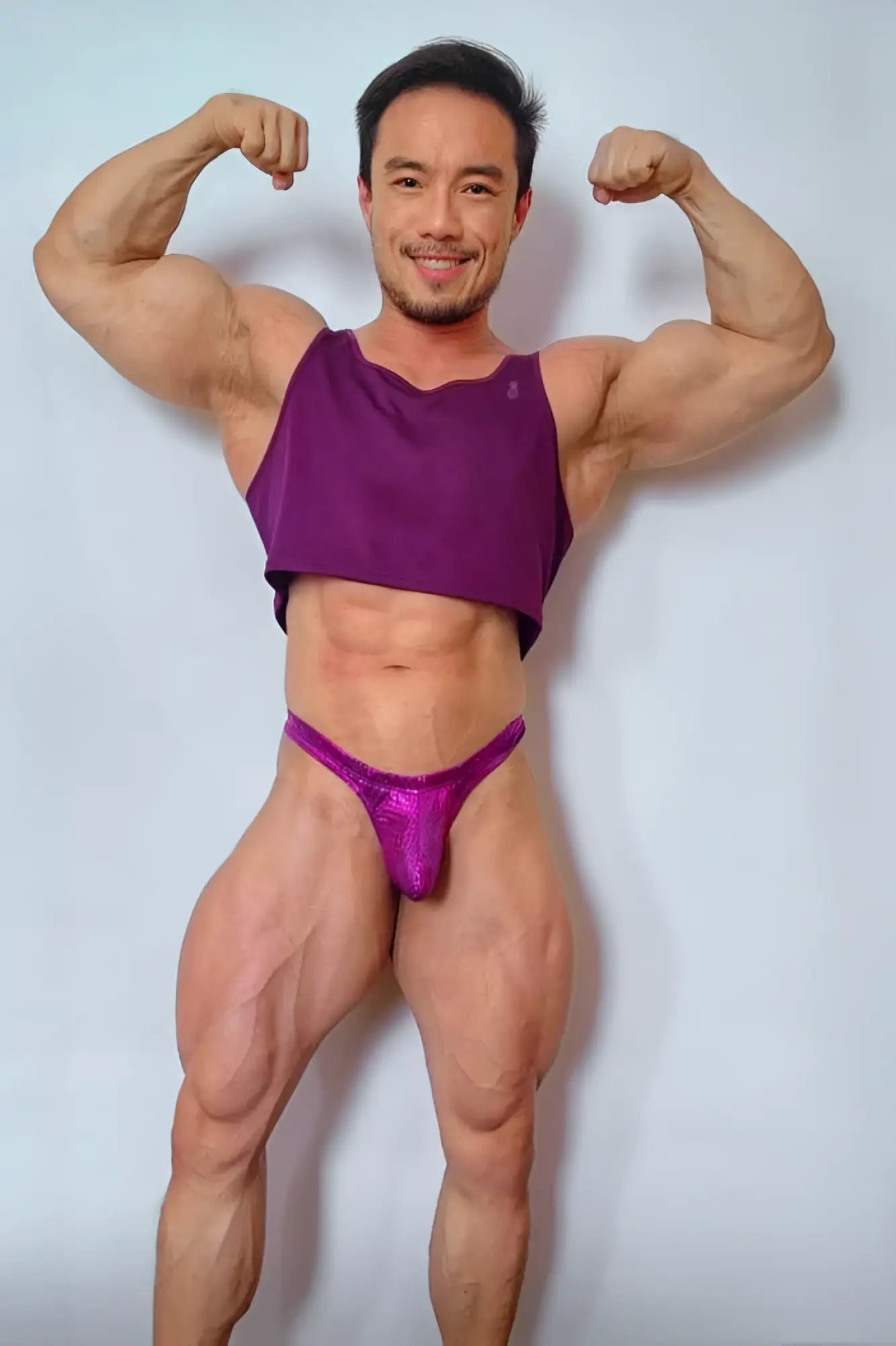 Metallica men’s thong with bulge pouch in purple metallic briefs featuring hot pink croc texture front view