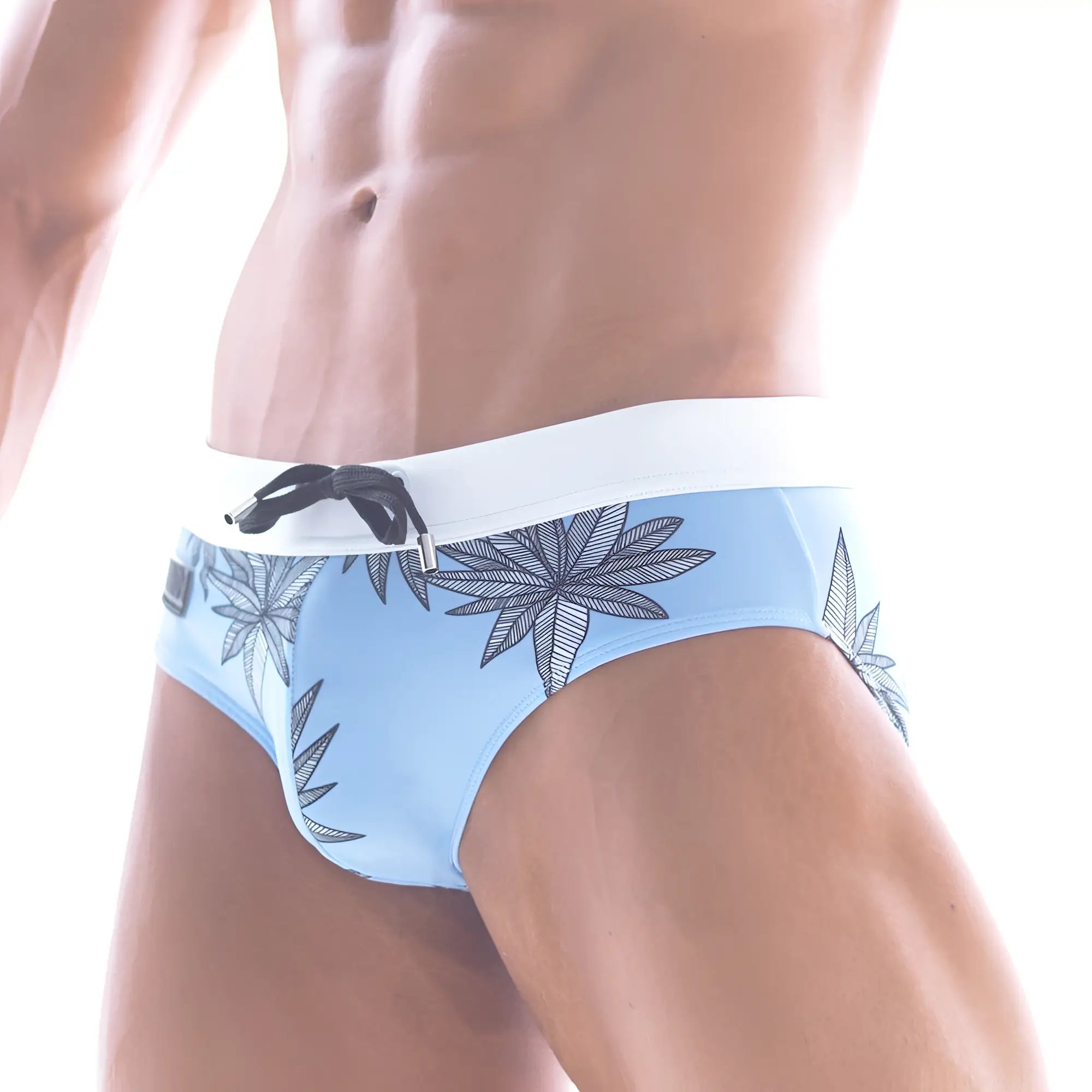 Light blue MetroMaleWear beach swim brief with white waistband and black leaf pattern for men
