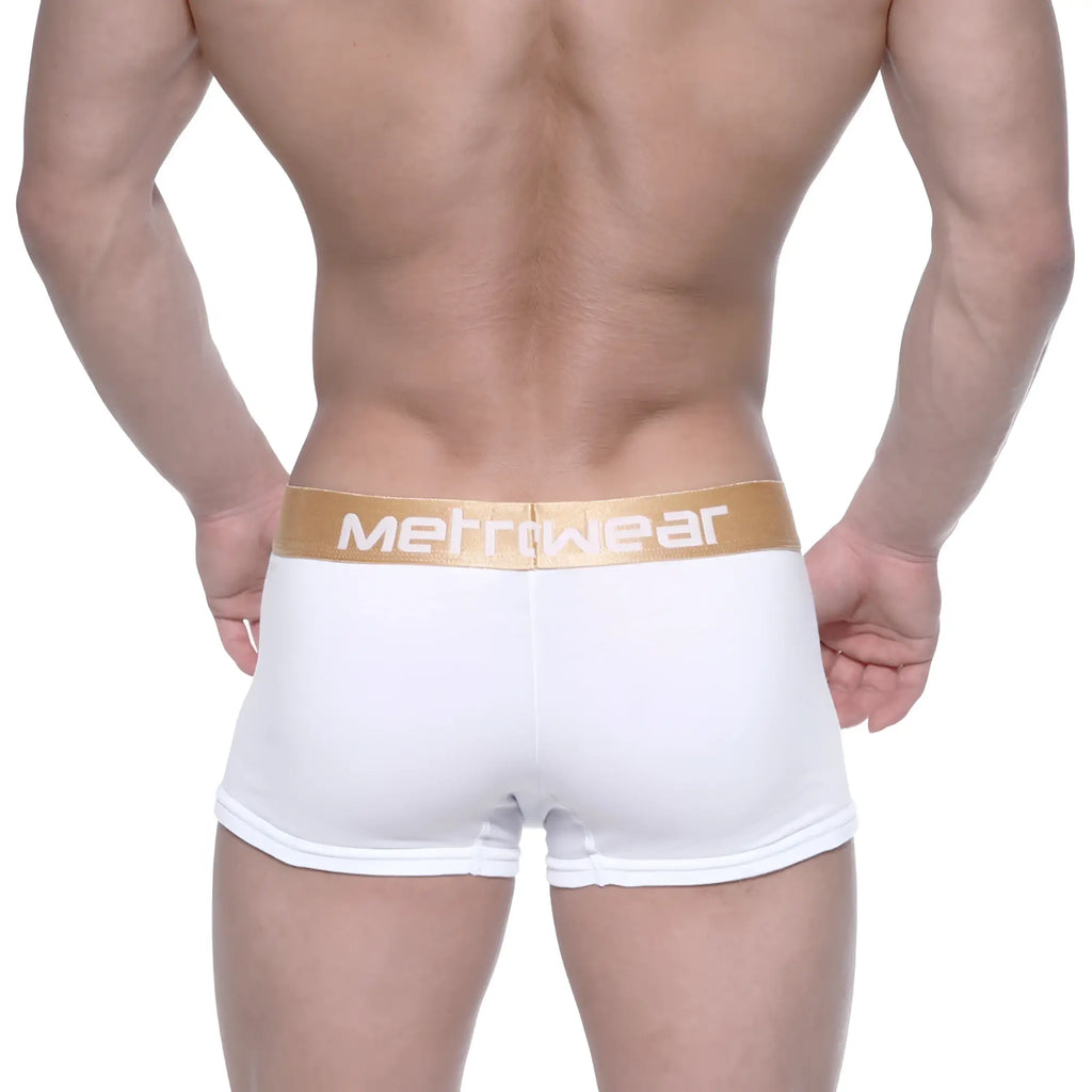 White metrowear boxer briefs with a gold waistband featuring the brand name in white lettering metro malewear body boxer brief