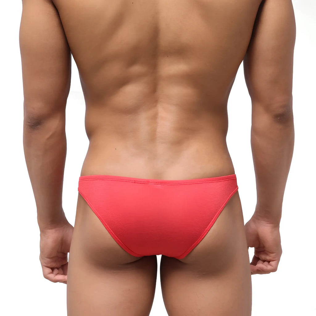Bright coral red form fitting seamless briefs with textured fabric shown from back in MetroMaleWear Bosillo bikini