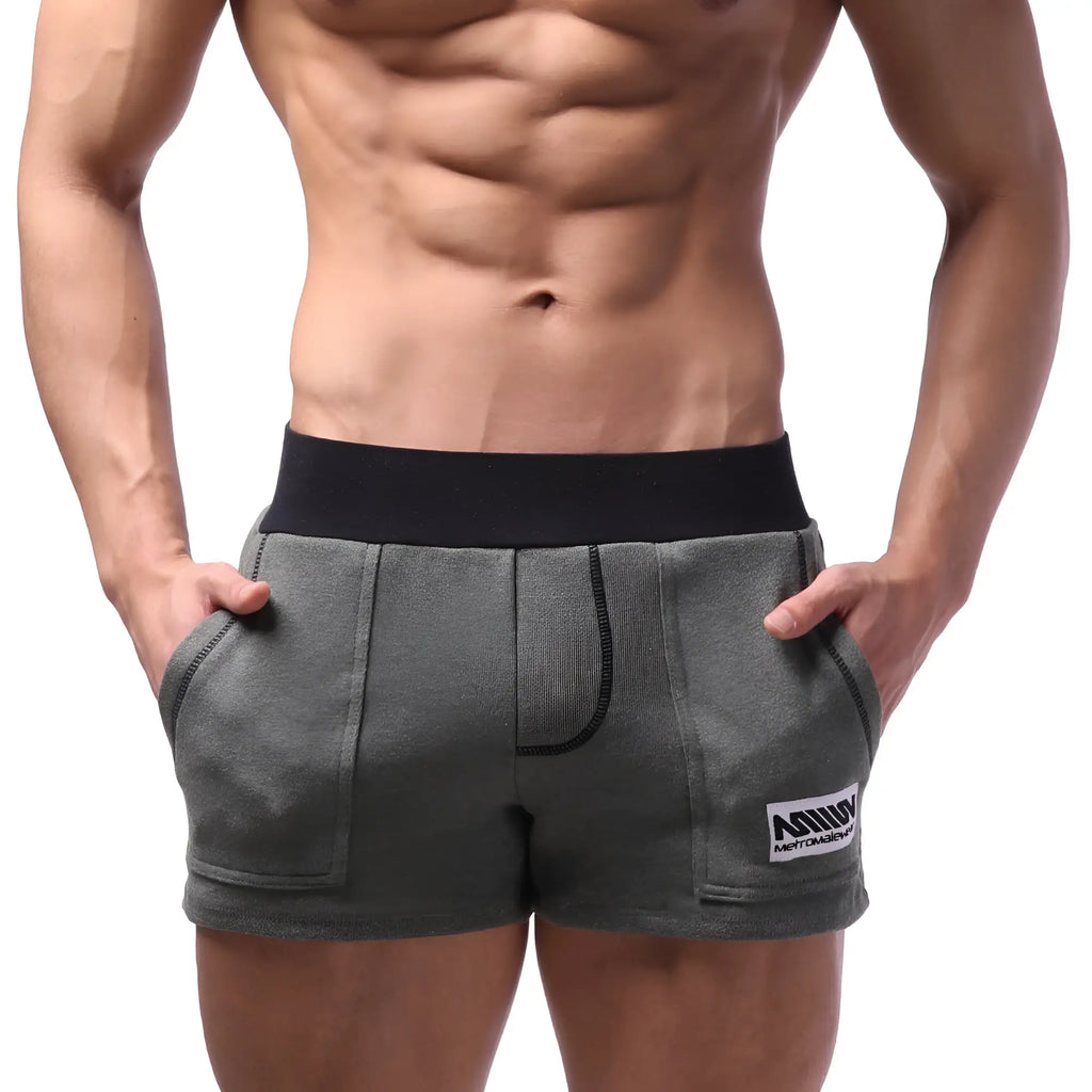 Gray MetroMaleWear Boston athletic shorts with black elastic waistband and white logo patch on lower right leg in khaki