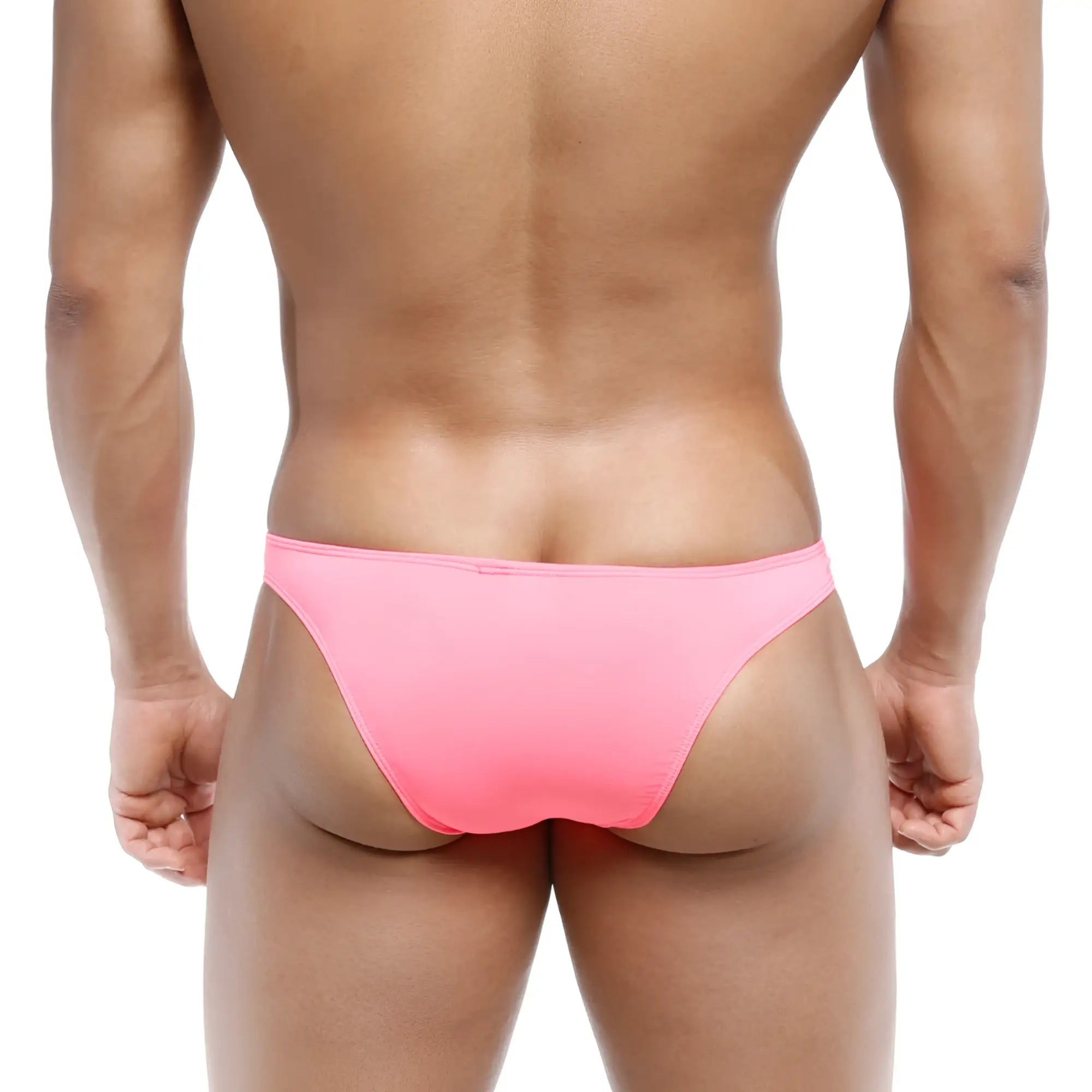 A vibrant pink form-fitting brief-style swimsuit by metromalewear featuring a bulge capri bikini design