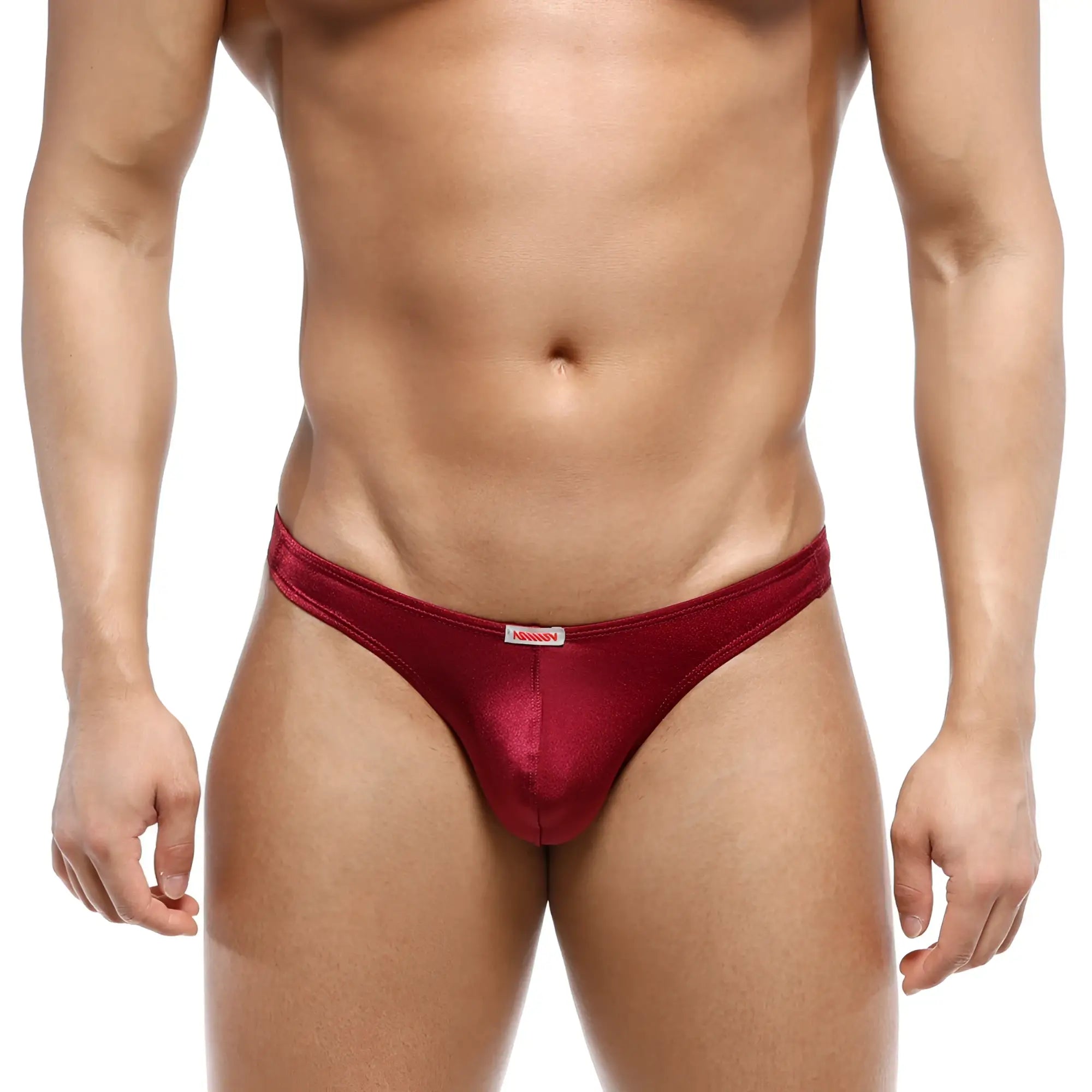 A shiny deep red satin thong with a small white MetroMaleWear brand tag at the waistband