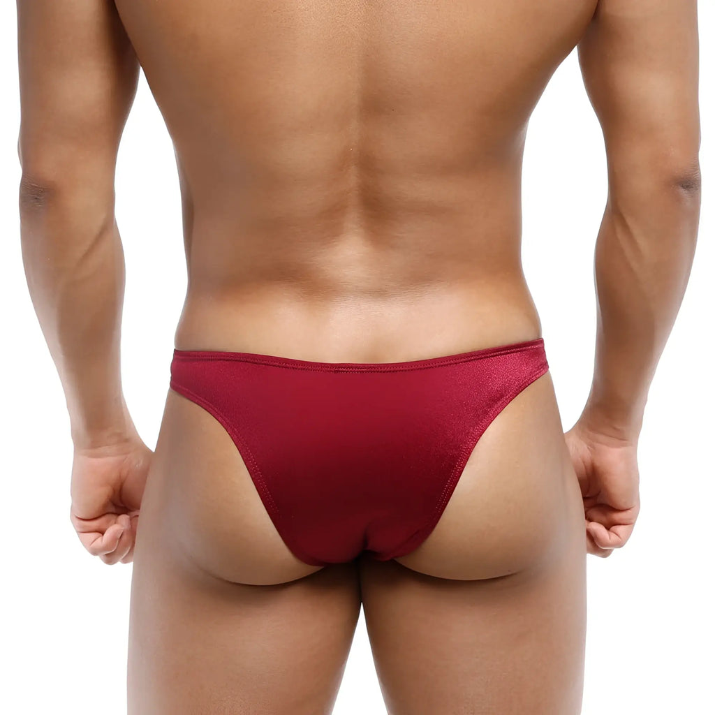 A sleek deep red metro malewear bulge capri bikini thong made of smooth stretchy fabric with subtle sheen