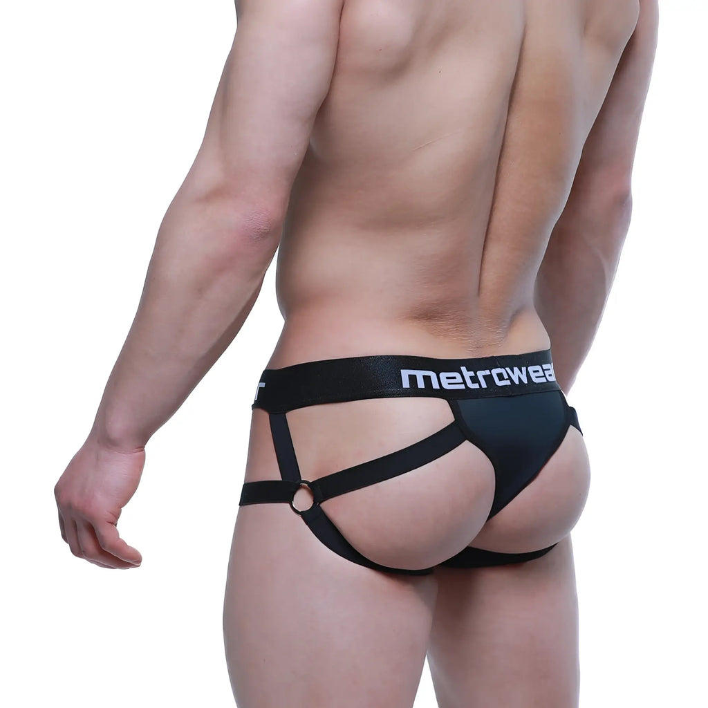 Black MetroMaleWear Calypso Jock Thong men’s briefs with strappy harness design and central ring in a front view