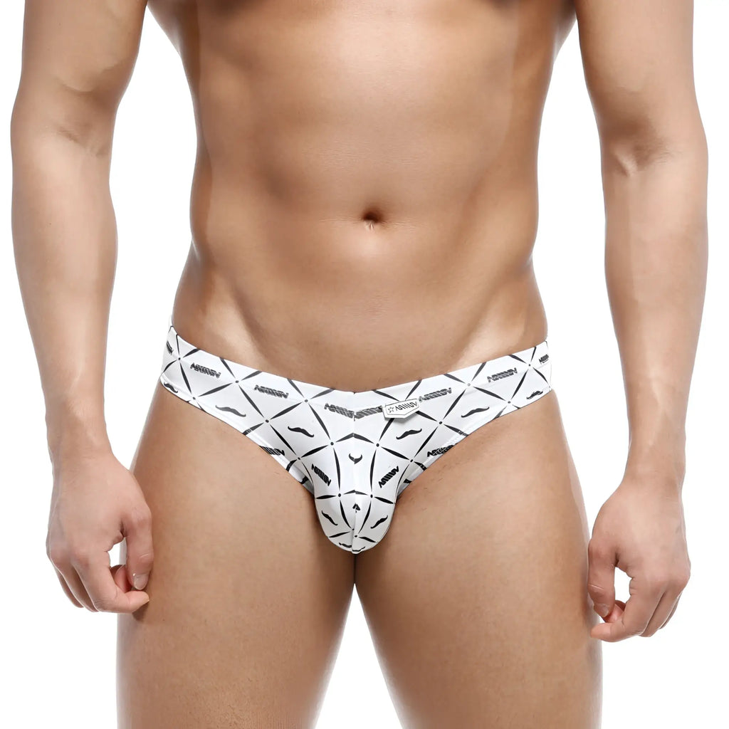White men’s briefs by metromalewear featuring bold black geometric patterns with stylized mustaches and abstract shapes