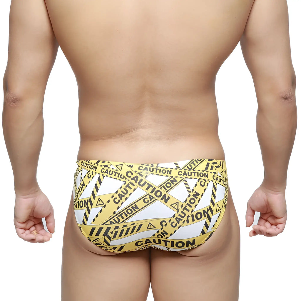 MetroMaleWear caution bikini white 5103-M60 swim trunks with yellow and black caution tape pattern
