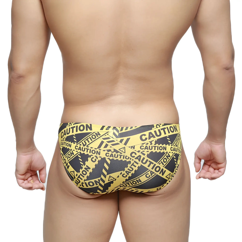 MetroMaleWear caution lowrise bikini swim trunks in yellow and black caution tape pattern for bold beachwear