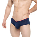 Navy blue mesh briefs with red trim and a small MetroMaleWear brand tag on the waistband from the Cheek Inmenso 2028-75 line