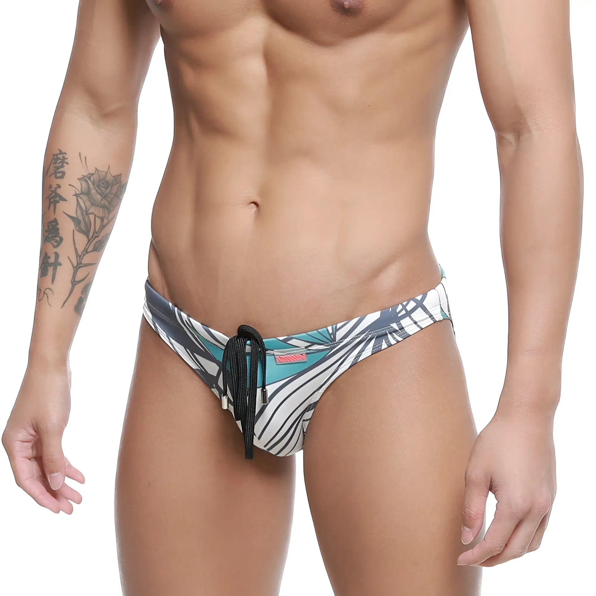 MetroMaleWear classic swim bikini meadow 4937-09 men’s swim trunks with bold teal black and white tropical leaf pattern