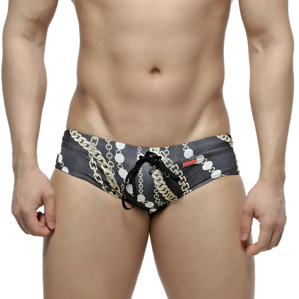 Black swim trunks metroMaleWear classic swim brief Rico 4914-95 with bold gold and white chain-link pattern and drawstring