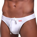 White swim trunks with drawstring waistband and small red logo on the side from metromalewear classic line