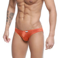 Orange satin briefs with a small white MetroMaleWear brand tag on the waistband from Colorado Jock Strap Ochre 5011-23