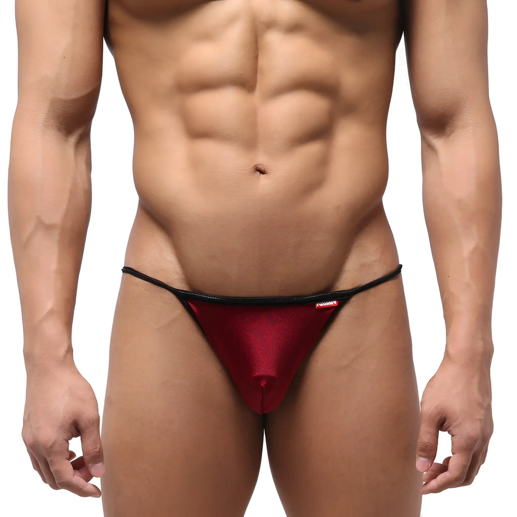 Red metallic thong swim bikini with black trim and small red MetroMaleWear brand tag for men