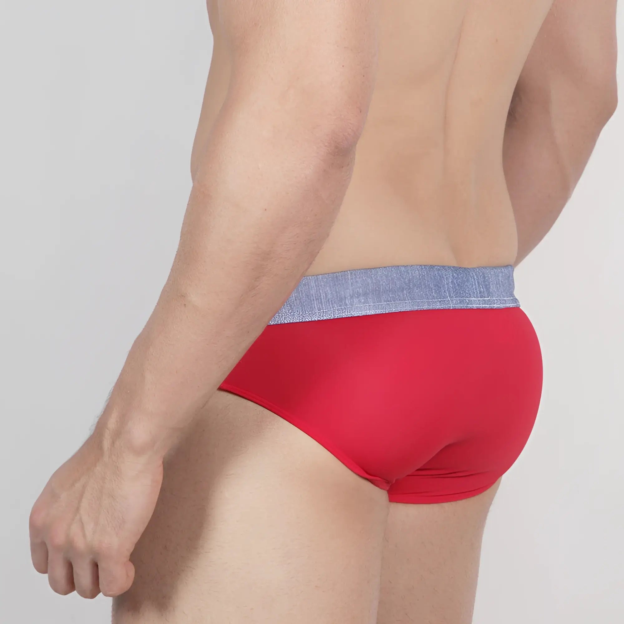 Red metro malewear denim swim brief with textured blue waistband designed for comfortable swimming use