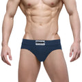 Navy blue MetroMaleWear Deseo Brief men’s briefs with a white logo patch on the waistband in dark blue color